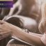 A woman folds her hands while in individual therapy.