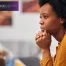 young woman in a serious therapy session discussing mental health topics with a professsional therapist
