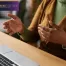 woman communicating during a online therapy session on her laptop