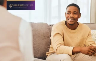 male therapy patient sits in therapist office during a counseling session