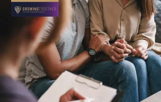 A man and woman sitting in couples therapy together.