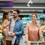A couple and their young daughter in a grocery store.